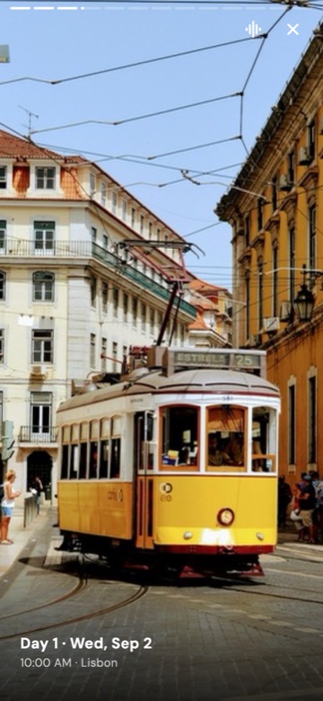 A WhimAway memory playing full screen: a yellow tram on a Lisbon street, with the day and place in small type at the bottom.